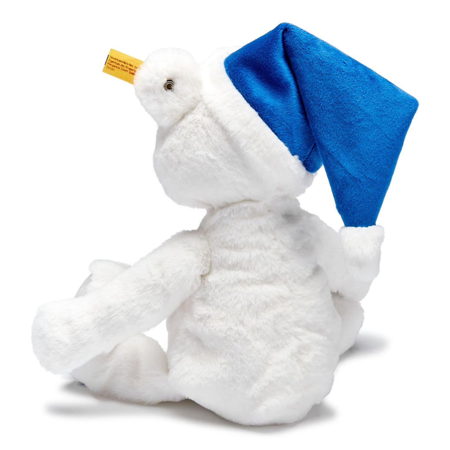 Weißer Steiff Teddybär mit dem markentypischen Knopf im Ohr und blauer Mütze mit BMW Logo bestickt